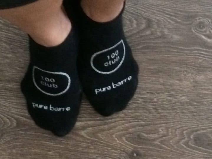 posing on my toes in my '100 Club' barre socks.  They are black with silver letters and numbers.