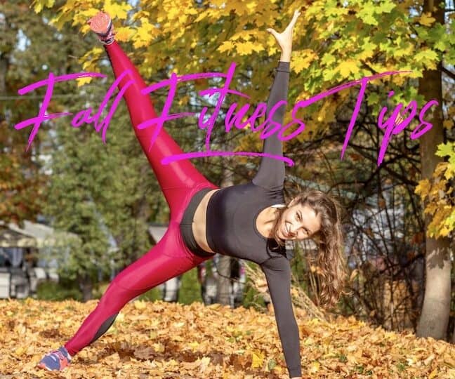 Lady doing a side plank in the leaves