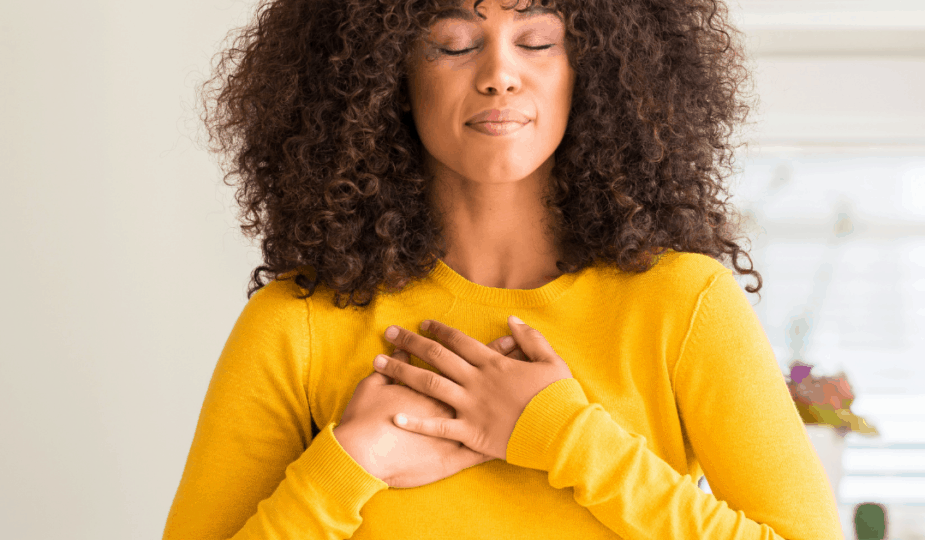 Lady with her hands over her heart in gratitude