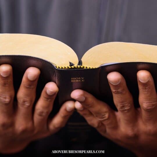 a man holding an open Bible