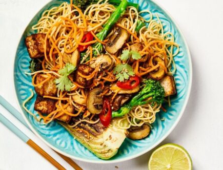 A teal blue plate of stir fry