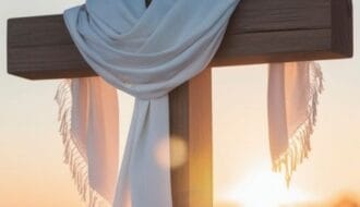 Wooden cross draped with a white cloth at sunrise, symbolizing true confidence in Christ through the Cross