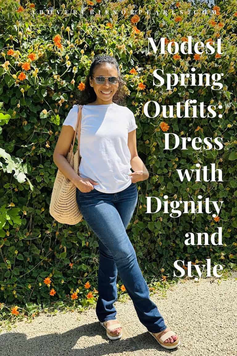 Woman in casual modest spring outfit wearing jeans, white tee, and woven bag at Echo Park with floral hedge background