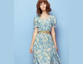 Modest spring fashion: woman wearing blue daisy-print dress and belt