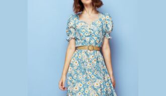 Modest spring fashion: woman wearing blue daisy-print dress and belt